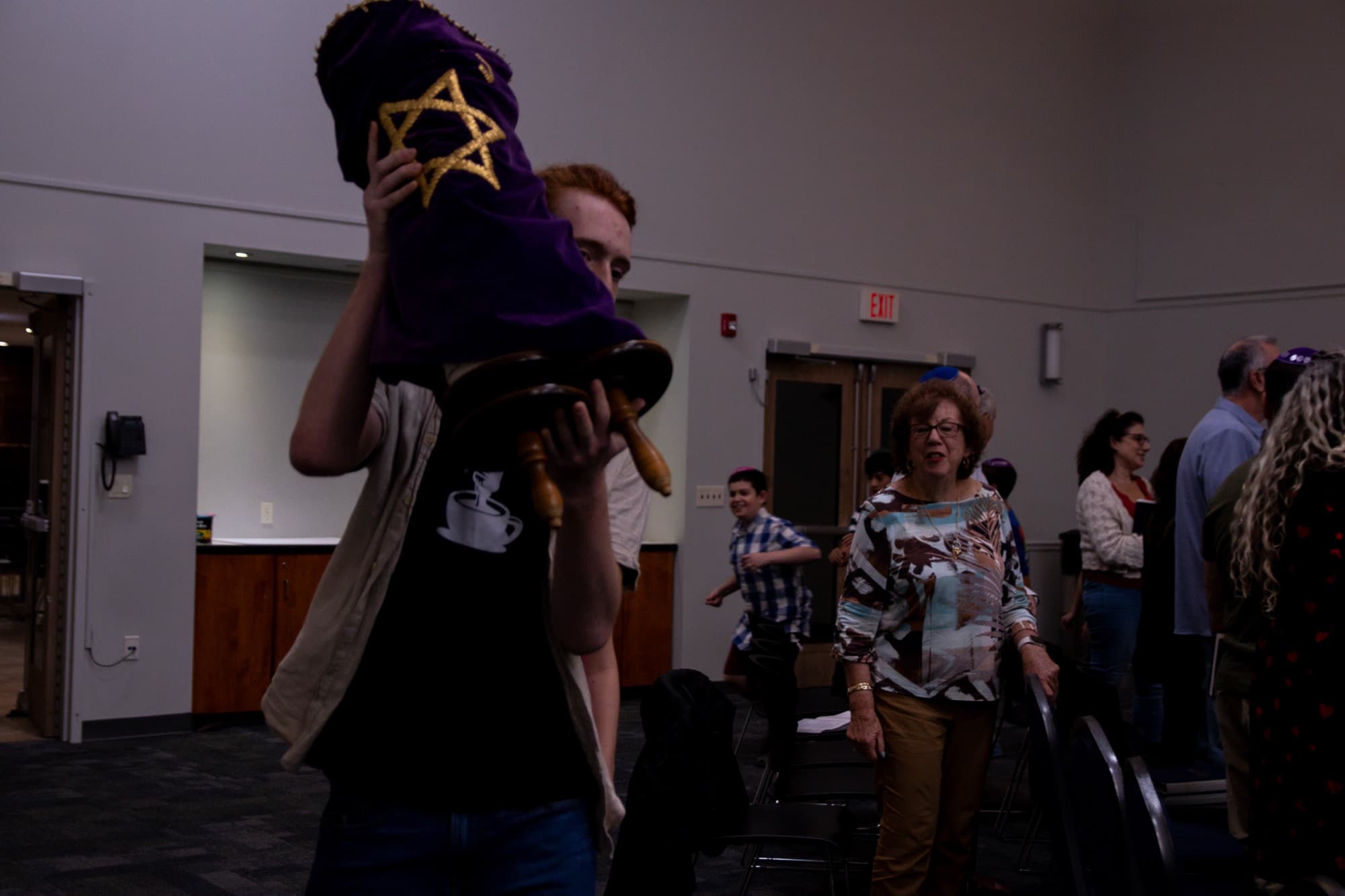 Joyful Torah procession through the congregation at TBS
